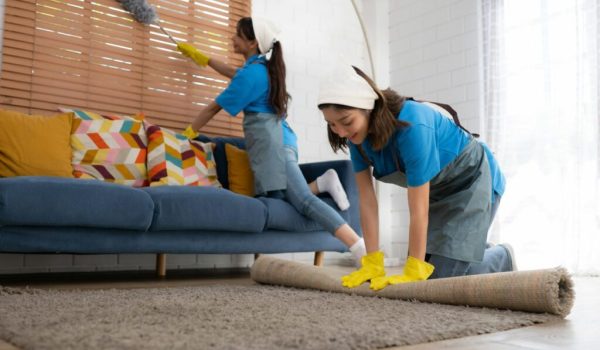 young-women-cleaning-maid-in-uniform-and-rubber-gloves-are-cleaning-the-room-fold-up-carpet-1024x682-1